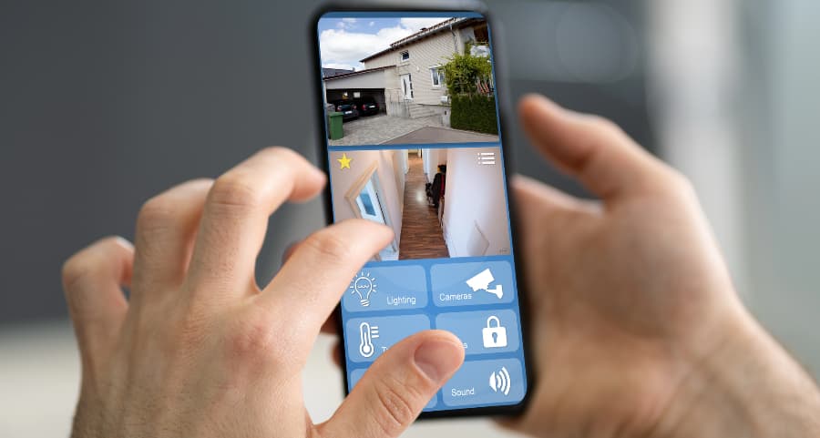 Resident looking at surveillance camera streams on a mobile device
